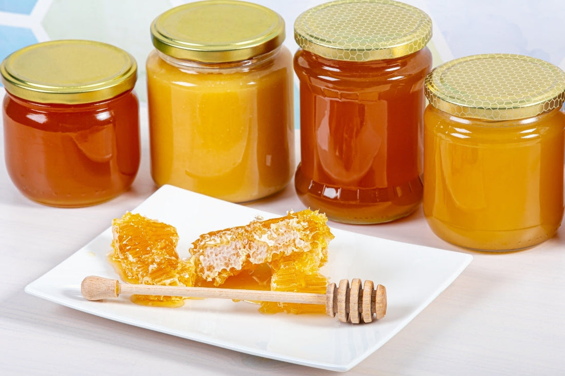 Honey jars with different color honey and honey ratings