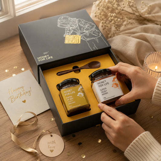 preparing honey jars inside the gift box as a birthday gift near the window in a soft lighting.